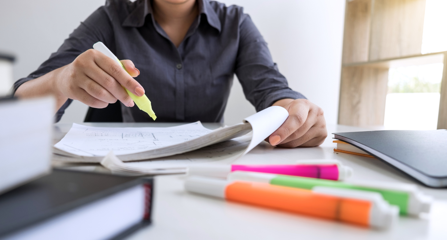 Student sat at desk writing career plan