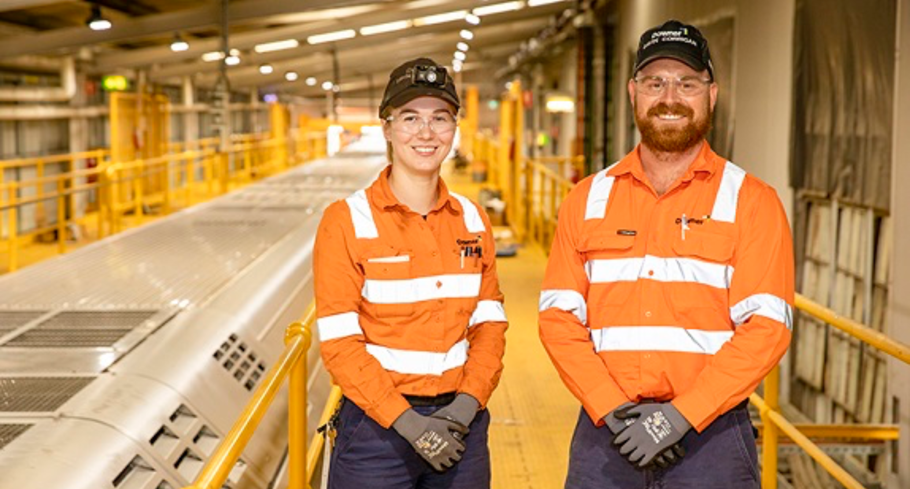 Two downer employees wearing orange high vis