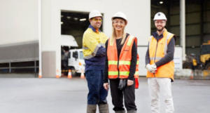 Three Downer employees wearing high vis with truck in the background