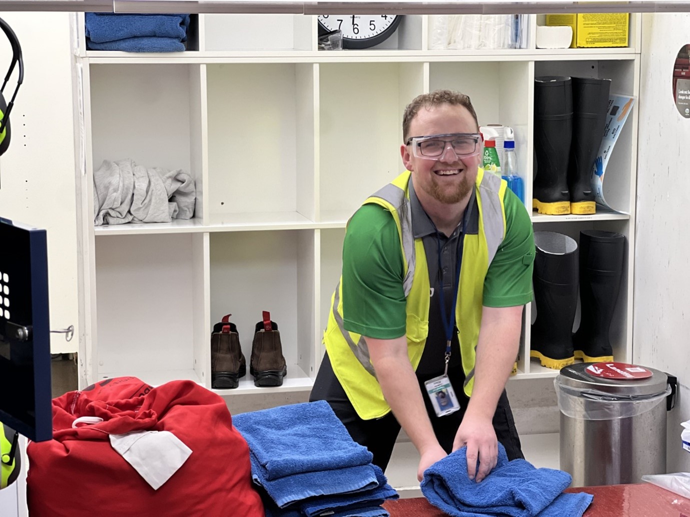 Andrew folding towels at work