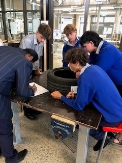 students playing the tyre game