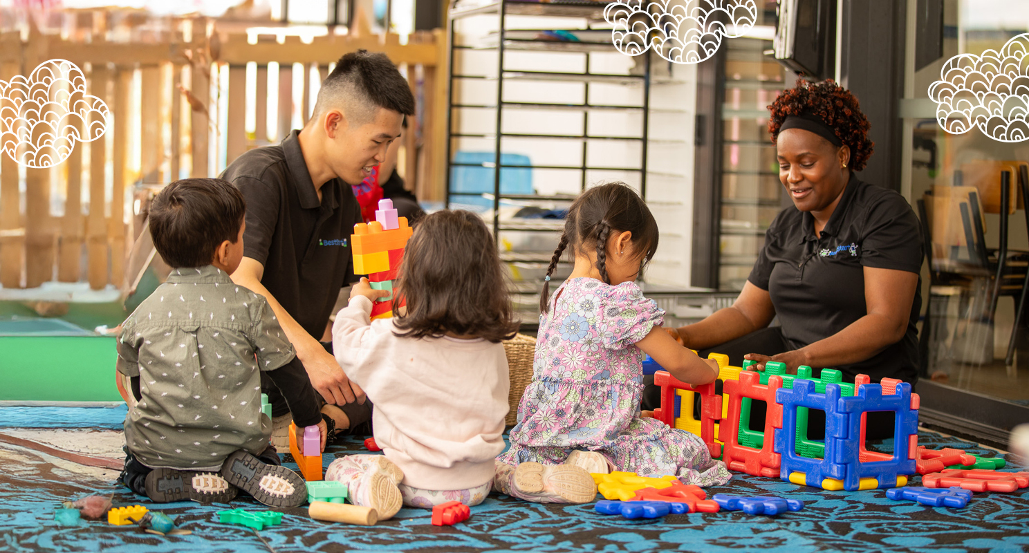 Two ECEs playing with children outside